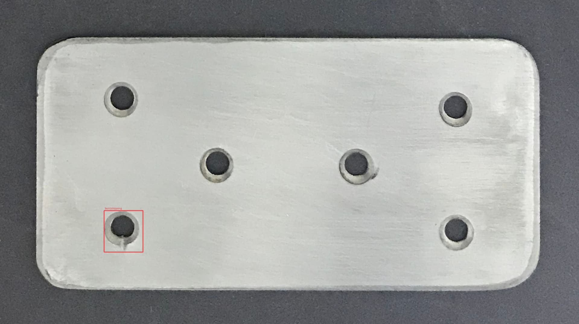 Metal part: Chipping around a hole detected
